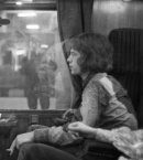 Paul McCartney and Mick Jagger on a train, 1967